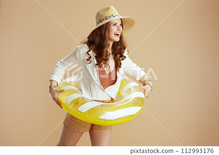 smiling elegant woman in blouse and shorts 112993176