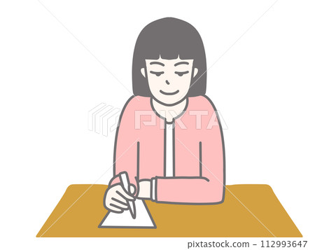 A woman wearing a pink suit and writing A woman wearing a pink suit and writing 112993647