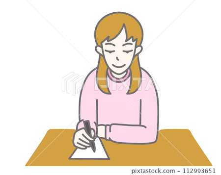 A woman wearing pink clothes and writing on paper A woman wearing pink clothes and writing on paper 112993651