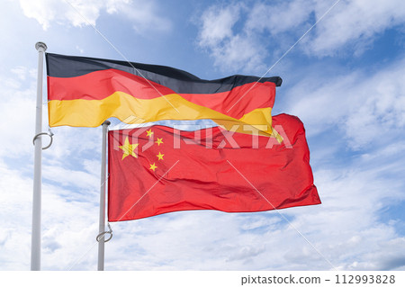 German and Chinese flags flutter in the wind 112993828