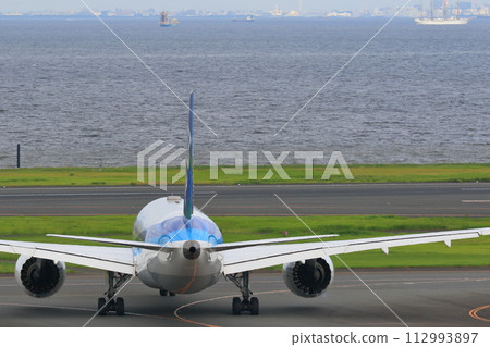 Passenger plane heading to the runway Jet plane Airport travel image Departure image Passenger plane heading to the runway Jet plane Airport travel image Departure image 112993897