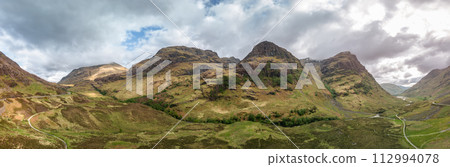 Drone captured super panorama shows vast Glen Coe valley with the towering Three Sisters above Drone captured super panorama shows vast Glen Coe valley with the towering Three Sisters above 112994078