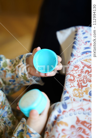 child's hands playing with small objects child's hands playing with small objects 112994130