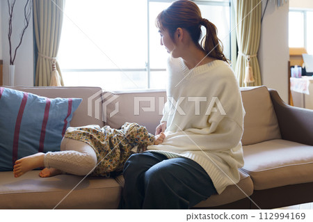 mother taking care of her child mother taking care of her child 112994169