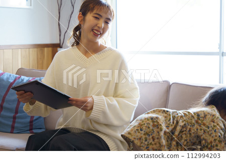 mother taking care of her child mother taking care of her child 112994203