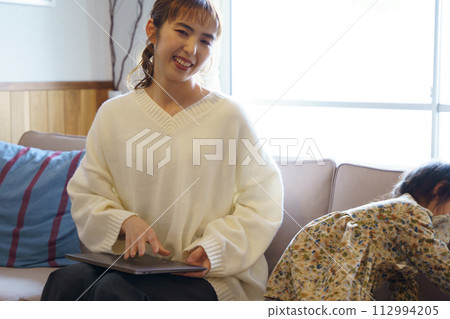mother taking care of her child mother taking care of her child 112994205