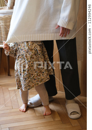 mother taking care of her child 112994246