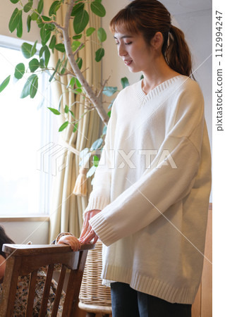 mother taking care of her child 112994247