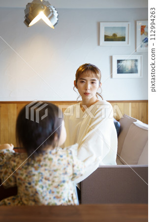 mother taking care of her child 112994263