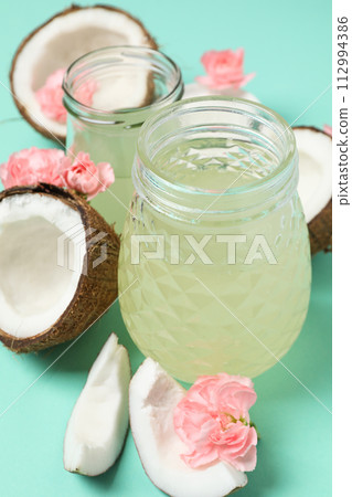 Coconut water, concept of tasty and natural coconut drink Coconut water, concept of tasty and natural coconut drink 112994386