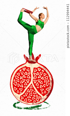Flexible young woman standing on pomegranate and training with fitness bands on white background. Creative conceptual collage. Flexible young woman standing on pomegranate and training with fitness bands on white background. Creative conceptual collage. 112994441