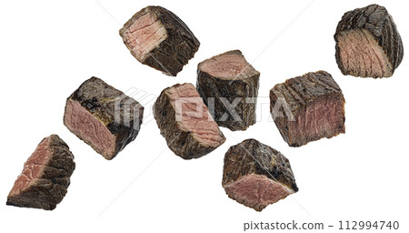 Medium rare steak pieces, sliced grilled beef cubes isolated on white background with clipping path Medium rare steak pieces, sliced grilled beef cubes isolated on white background with clipping path 112994740