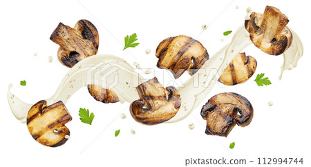Mushroom sauce, white cream splash with falling champignon slices isolated on white background with clipping path Mushroom sauce, white cream splash with falling champignon slices isolated on white background with clipping path 112994744