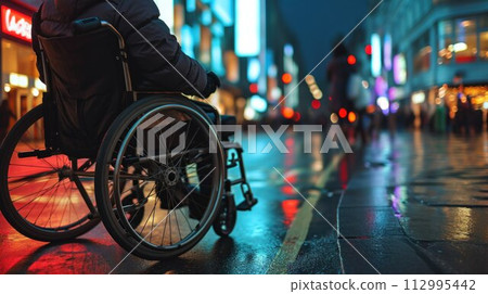 Man on wheelchair cross the road at dusk, Lifestyle living in street transport 112995442