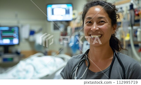 Female Doctor Wearing Scrubs In Hospital Corridor Female Doctor Wearing Scrubs In Hospital Corridor 112995719