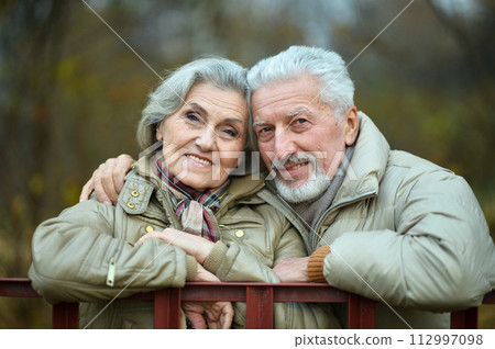 Loving mature couple in the park in summer 112997098