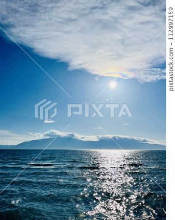 Scenic sunset over Ioninan sea in Vlore Albania. Vertical photo. Scenic sunset over Ioninan sea in Vlore Albania. Vertical photo. 112997159