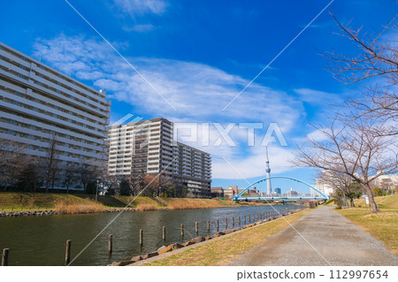 Former Nakagawa and Fureai Bridge overlooking the Tokyo Sky Tree, Tokyo 112997654