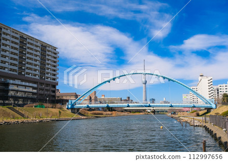 Former Nakagawa and Fureai Bridge overlooking the Tokyo Sky Tree, Tokyo 112997656