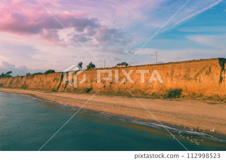 The steep clayey shore of the Black Sea. Odessa region, Ukraine 112998523
