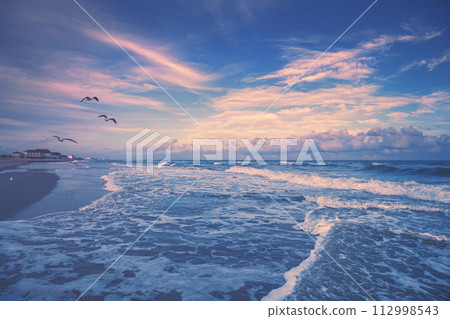 Seascape in the early morning. Sunrise in the sandy beach with beautiful sky 112998543