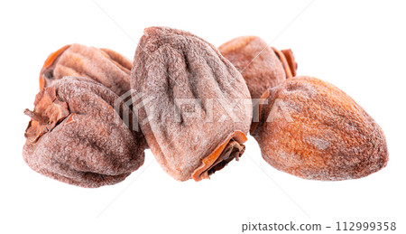 Dried persimmon isolated on white background. Dried fruit snack. Dried persimmon isolated on white background. Dried fruit snack. 112999358