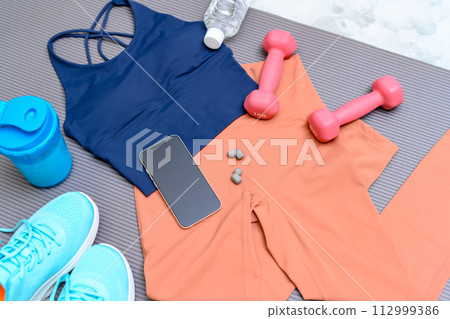 Item set for muscle training girls who are starting to exercise are lined up on a rug on the floor Women's wear Background material Background Item set for muscle training girls who are starting to exercise are lined up on a rug on the floor Women's wear Background material Background 112999386