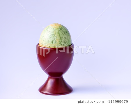 Colored egg. Traditional Easter food and decoration. Colored egg. Traditional Easter food and decoration. 112999679