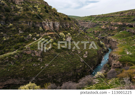 Panoramic view of Aksu canyon with blue water in spring river in Kazakhstan Panoramic view of Aksu canyon with blue water in spring river in Kazakhstan 113001225