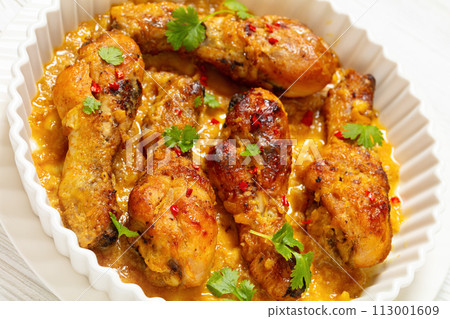 chicken drumsticks in pineapple sauce, top view chicken drumsticks in pineapple sauce, top view 113001609