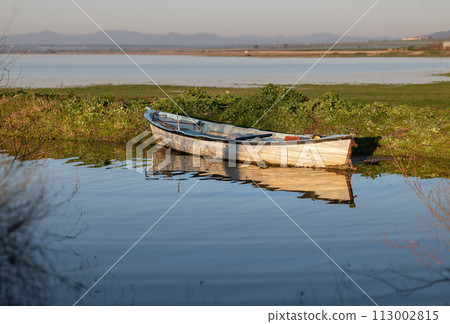 sunrise and boats on the lake 113002815