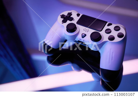 Gamepad on abstract background with light effects 113003107