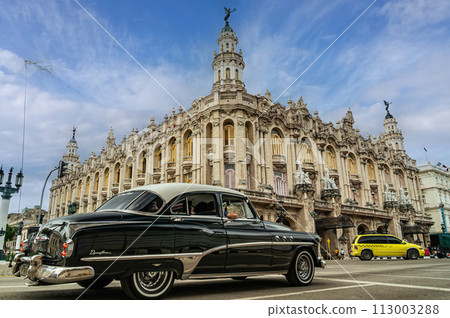 Retro car on Havana street in front of the Grand Theater. Gran Teatro de La Habana. Cuba. Low angle. 113003288