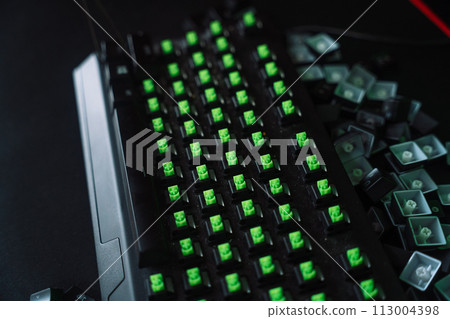 Cleaning a dirty gaming keyboard with keycaps and green switches removed 113004398