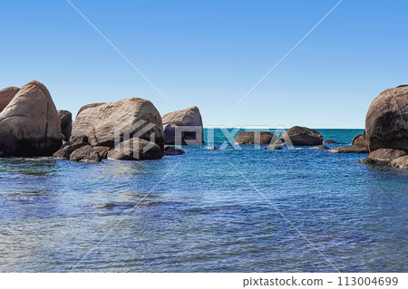 Huge rocks on the shore of the South China Sea in the World's End park. Sanya, China 113004699
