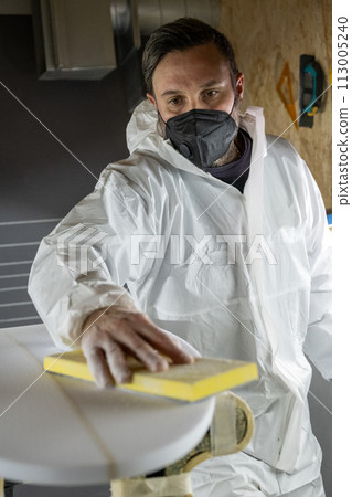 Shaper working on surf board Shaper working on surf board 113005240