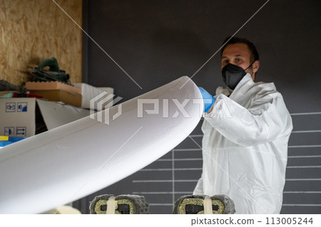 Shaper working on surf board Shaper working on surf board 113005244