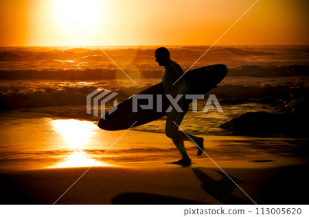 Surfer running Surfer running 113005620