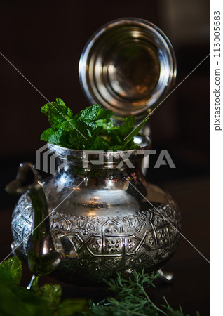 Traditional Moroccan tea as symbol of the hospitality of Moroccan people Traditional Moroccan tea as symbol of the hospitality of Moroccan people 113005683