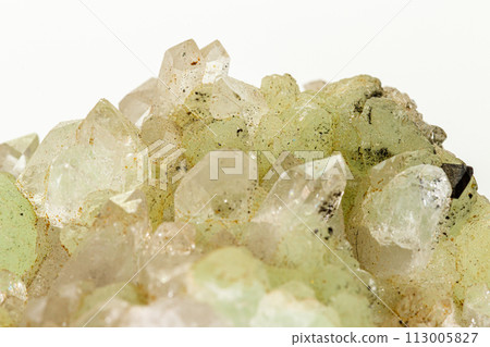Macro stone mineral Prehnite Babingtonite On a white background 113005827