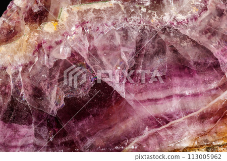 Macro stone mineral Fluorite on a black background 113005962