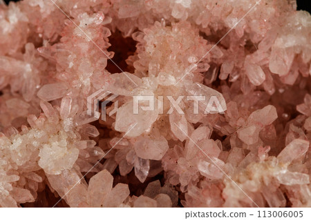 Macro stone mineral pink quartz amethyst on a black background 113006005