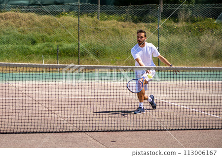 Tennis player performing a drop shot Tennis player performing a drop shot 113006167