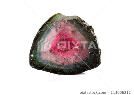 Macro tourmaline mineral stone on white background Macro tourmaline mineral stone on white background 113006212