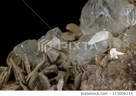 Macro stone Topaz mineral on a black background Macro stone Topaz mineral on a black background 113006214