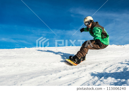 Snowboard freerider in the mountains 113006240