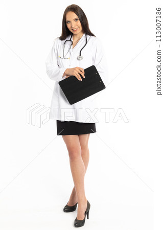 Young lady doctor on internship, waiting to issue an order in a new workplace. 113007186