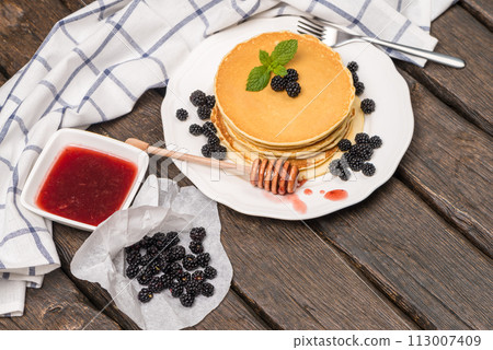 Pancakes with fresh blackberries 113007409
