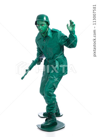 Man on a green toy soldier costume Man on a green toy soldier costume 113007581
