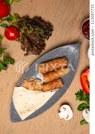Top view Chicken Kebab Skewers with Grilled Vegetables and Fresh Herbs on Wooden Table Top view Chicken Kebab Skewers with Grilled Vegetables and Fresh Herbs on Wooden Table 113007733